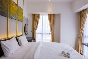 Elegant 2BR Apartment at M-Town Signature near Shopping Mall By Travelio