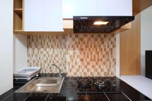 Simply Look Studio at Margonda Residence 5 Apartment By Travelio