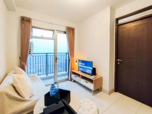 Modern 2BR at Mekarwangi Square Cibaduyut Apartment By Travelio
