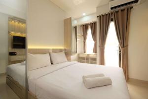 Cozy and Restful Studio at Transpark Cibubur Apartment By Travelio