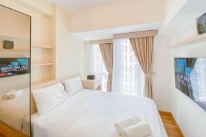 Good Price and Homey Studio at Tokyo Riverside PIK 2 Apartment By Travelio