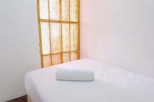 Cozy 2BR at Jarrdin Cihampelas Apartment By Travelio