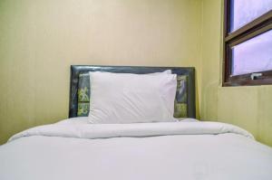 Nice and Cozy 2BR Apartment at Atria Residence Gading Serpong By Travelio