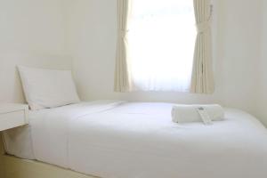 Stylish Modern 2BR Apartment at Parahyangan Residence By Travelio