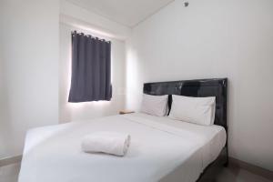 Fully Furnished and Cozy 2BR at Transpark Cibubur Apartment By Travelio