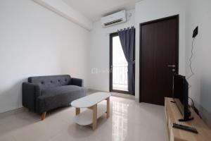 Fully Furnished and Cozy 2BR at Transpark Cibubur Apartment By Travelio