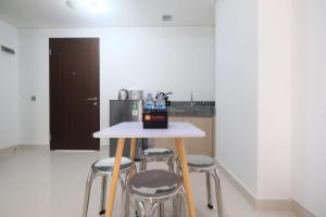 Fully Furnished and Cozy 2BR at Transpark Cibubur Apartment By Travelio