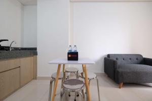 Fully Furnished and Cozy 2BR at Transpark Cibubur Apartment By Travelio