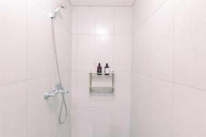 Homey and Restful Studio Royal Sentul Park Apartment By Travelio