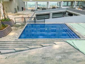 Homey and Restful Studio Royal Sentul Park Apartment By Travelio