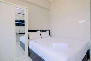 Cozy and Restful Studio LRT City Sentul - Royal Sentul Park Apartment By Travelio