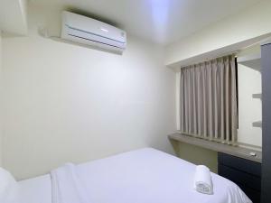 Well Furnished and Comfortable 2BR Meikarta Apartment By Travelio
