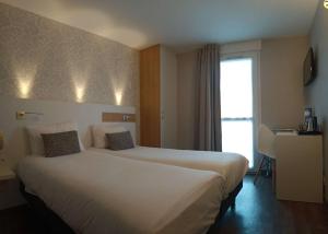 Hotels Brit Hotel Les Alizes : Chambre Lits Jumeaux