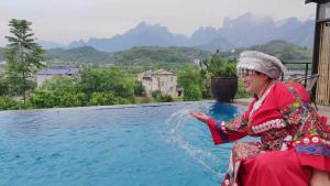 Tujia folk houses - 3hvězdičkové hotely ve městě Čang-ťia-ťie