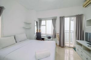 Simple and Cozy Living Studio Apartment at Margonda Residence 3 By Travelio