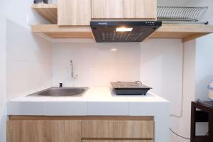 Modern and Homey Studio at Gunung Putri Apartment By Travelio