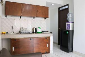 Cozy 2BR at Mekarwangi Square Cibaduyut Apartment By Travelio