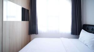 Simple and Comfortable Living 1BR at The City Square Apartment By Travelio