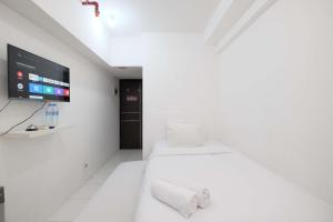 Simply Look Studio at Mont Blanc Bekasi Apartment By Travelio