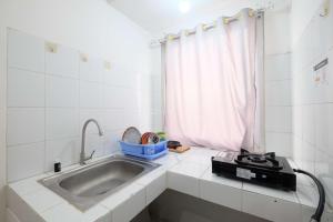 Simply Look Studio at Mont Blanc Bekasi Apartment By Travelio