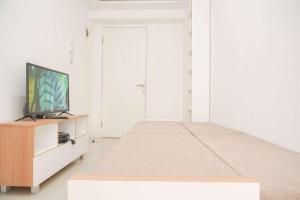 Good Choice and Minimalist 1BR Bassura City Apartment By Travelio