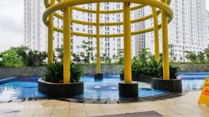 Cozy 2BR with Modern Design Bassura City Apartment near Mall By Travelio