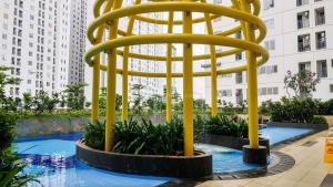 Cozy 2BR with Modern Design Bassura City Apartment near Mall By Travelio