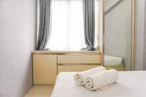 Cozy 2BR with Modern Design Bassura City Apartment near Mall By Travelio