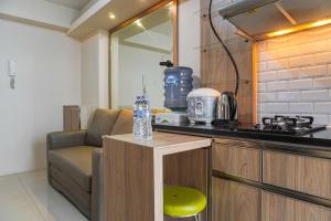 Cozy 2BR with Modern Design Bassura City Apartment near Mall By Travelio