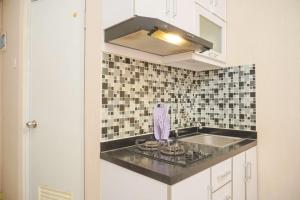 Cozy 2BR Green Pramuka City Apartment near Shopping Mall By Travelio