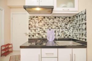 Cozy 2BR Green Pramuka City Apartment near Shopping Mall By Travelio