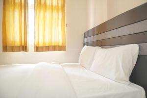 Cozy 2BR Green Pramuka City Apartment near Shopping Mall By Travelio