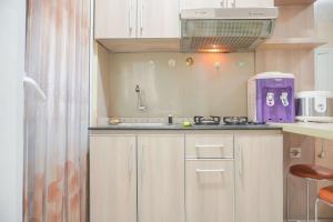 Good Deal and Relaxing 2BR Green Pramuka City Apartment By Travelio