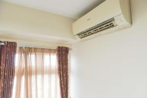 Good Deal and Relaxing 2BR Green Pramuka City Apartment By Travelio