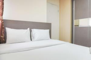 Good Deal and Relaxing 2BR Green Pramuka City Apartment By Travelio