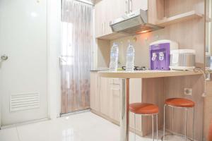 Good Deal and Relaxing 2BR Green Pramuka City Apartment By Travelio