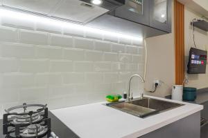 Strategic and Warm Studio at Bassura City Apartment By Travelio