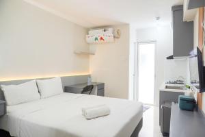 Strategic and Warm Studio at Bassura City Apartment By Travelio