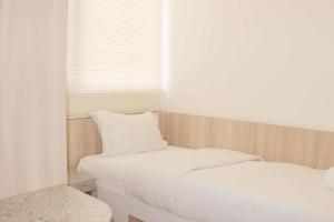 Serene and Cozy 2BR at Meikarta Apartment By Travelio