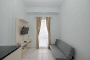 Comfy and Homey 2BR at Patraland Urbano Apartment By Travelio