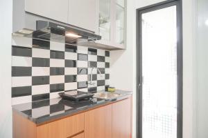 Gorgeous and Homey 2BR Bassura City Apartment near Mall By Travelio