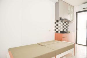 Gorgeous and Homey 2BR Bassura City Apartment near Mall By Travelio