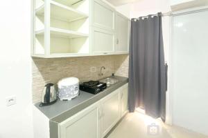 Full Furnished and Homey 2BR Bassura City Apartment near Mall By Travelio