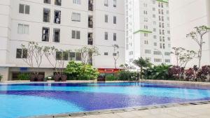 Comfy 2BR Bassura City Apartment near Bassura Mall By Travelio
