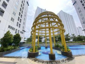 Best Deal and Homey 2BR Bassura City Apartment By Travelio