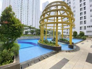 Best Deal and Homey 2BR Bassura City Apartment By Travelio