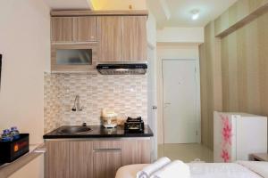 Comfortable Fully Furnished Studio Green Pramuka City Apartment By Travelio