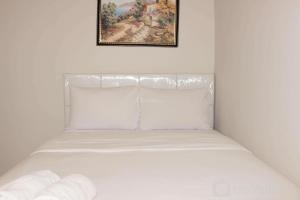 Minimalist and Homey 1BR at Bassura City Apartment By Travelio