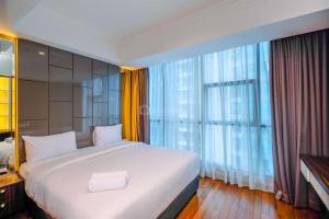 Elegant and Spacious 3BR Apartment at Casa Grande Residence By Travelio