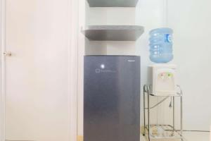 Warm and Cozy 2BR Green Pramuka Apartment near Mall By Travelio